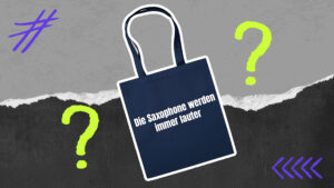 Tasche mit Zitat darauf und Fragezeichen darum